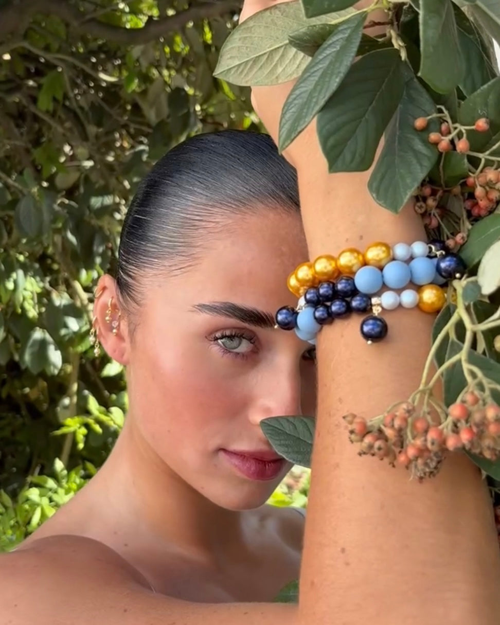 Golden crunch, deepest navy squeezy crystal, crystal pearl beaded bracelet, crystal pearl charm