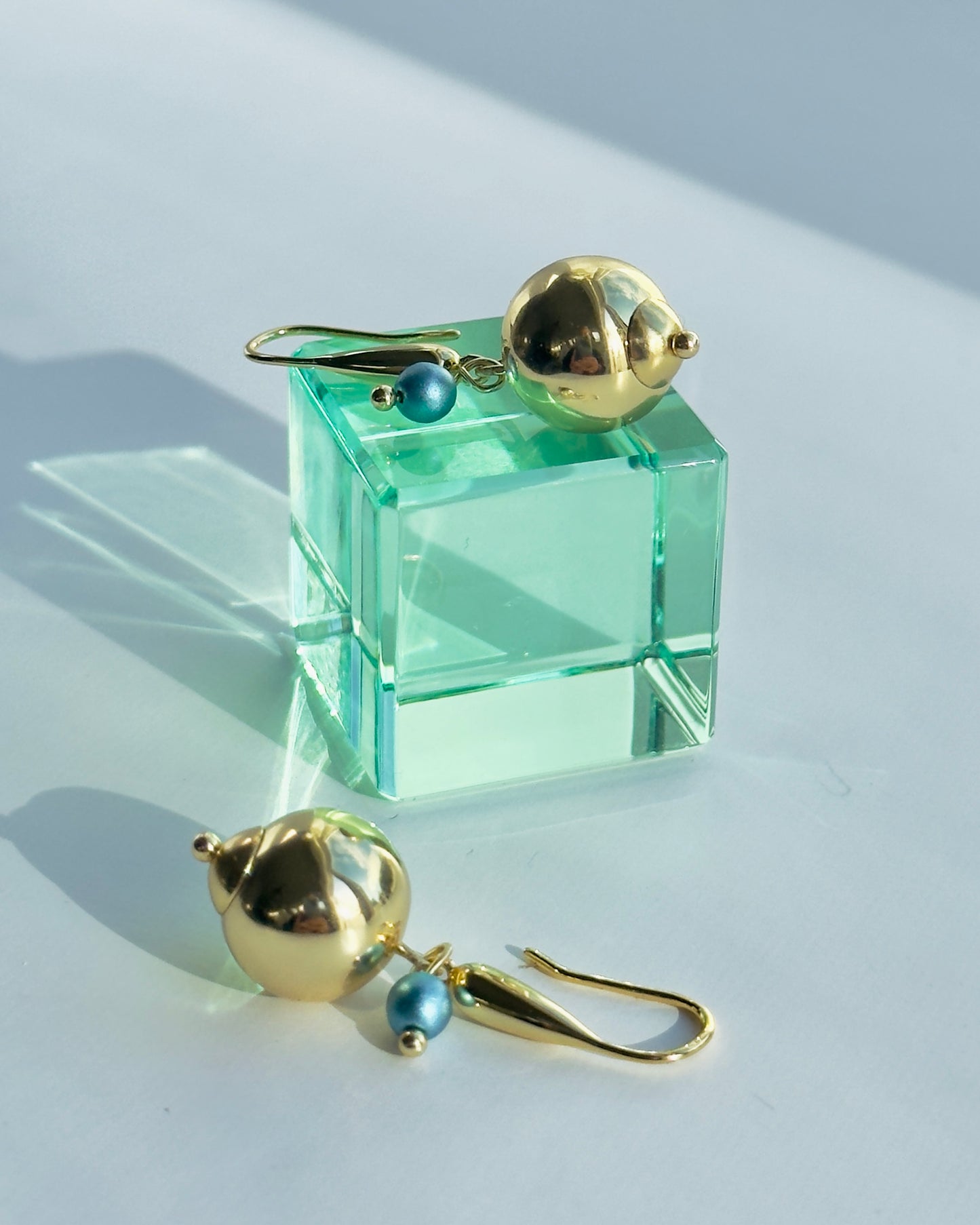 Roxie belle gold drop earrings, petrol blue pearl charm