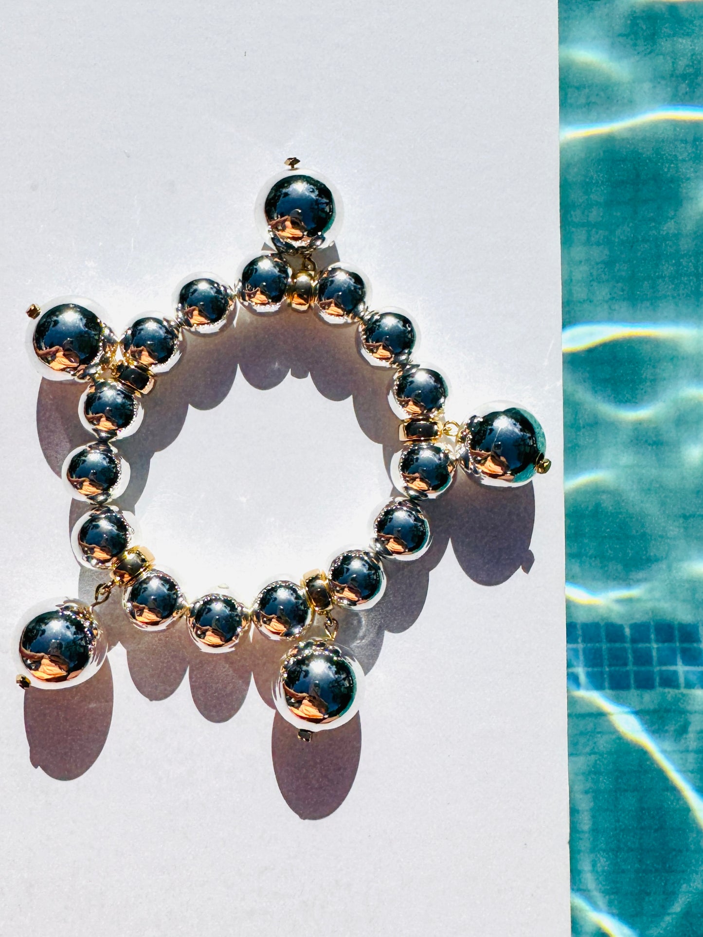 Charmed life silver multi drop charm bracelet