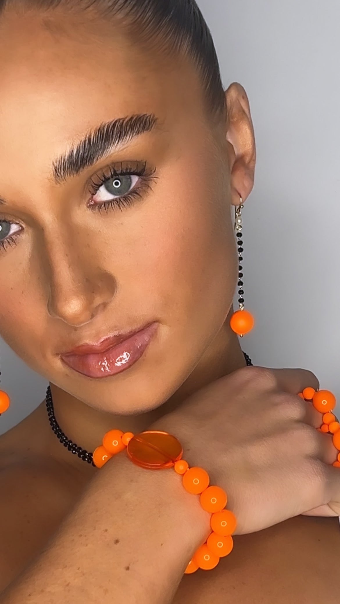 Lila black + neon orange pearl long drop earrings