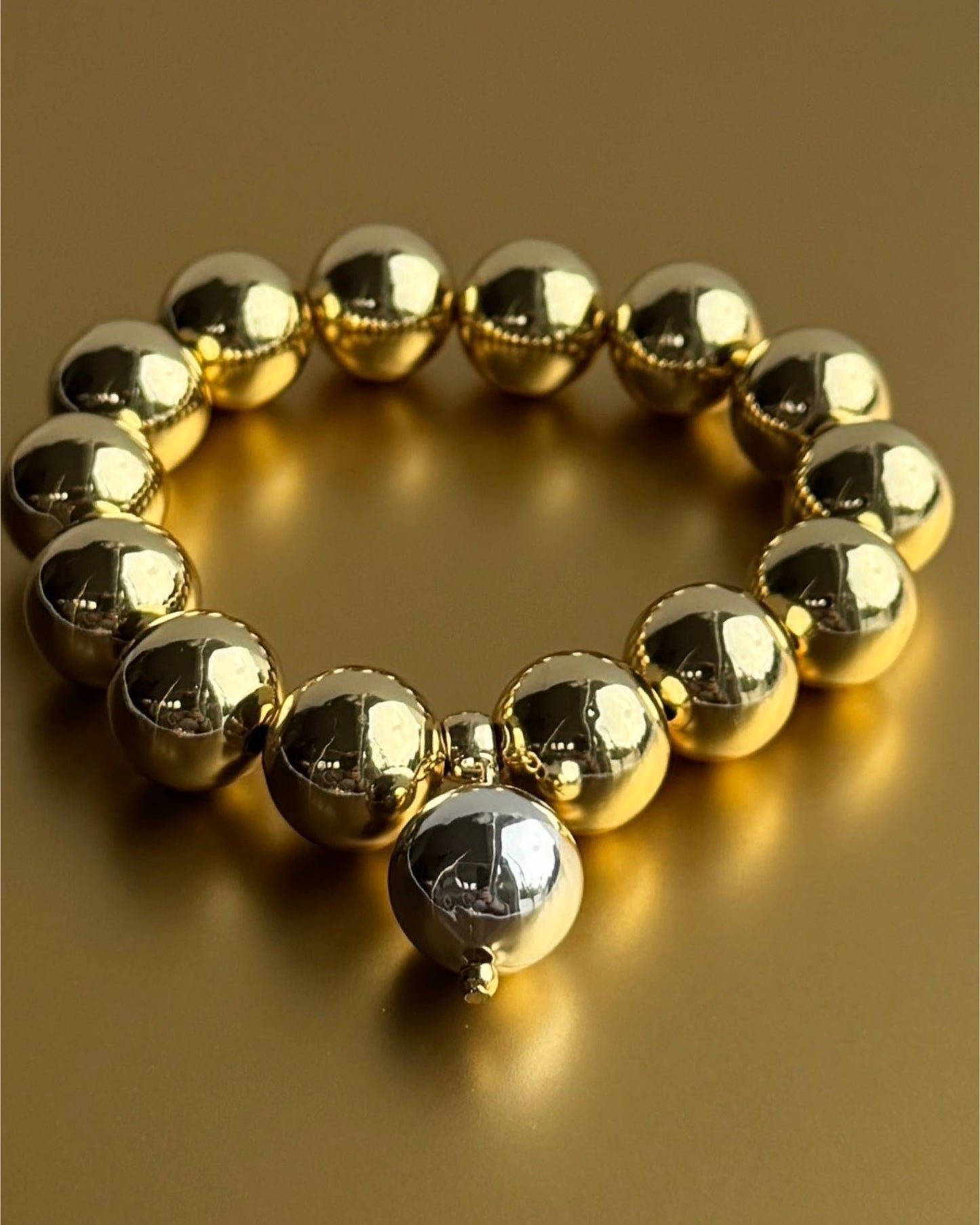 Gold dream beaded, silver charm bracelet