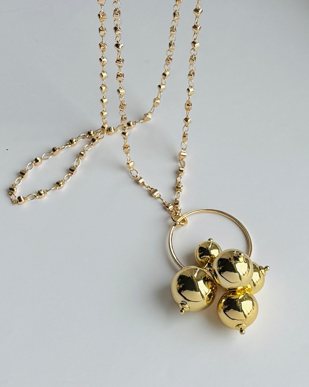 Gayle long drop gold beaded pendant necklace