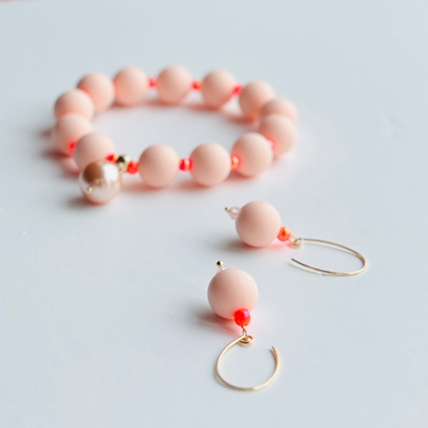 Beau peach + neon orange bracelet, pearl charm