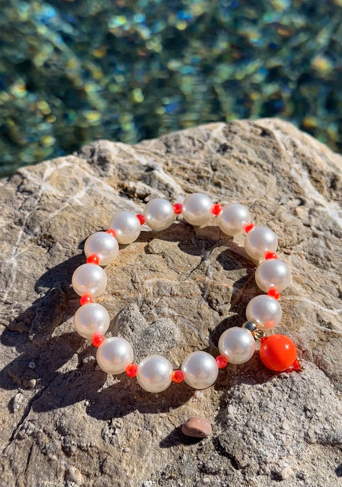 Pearl + neon orange bracelet