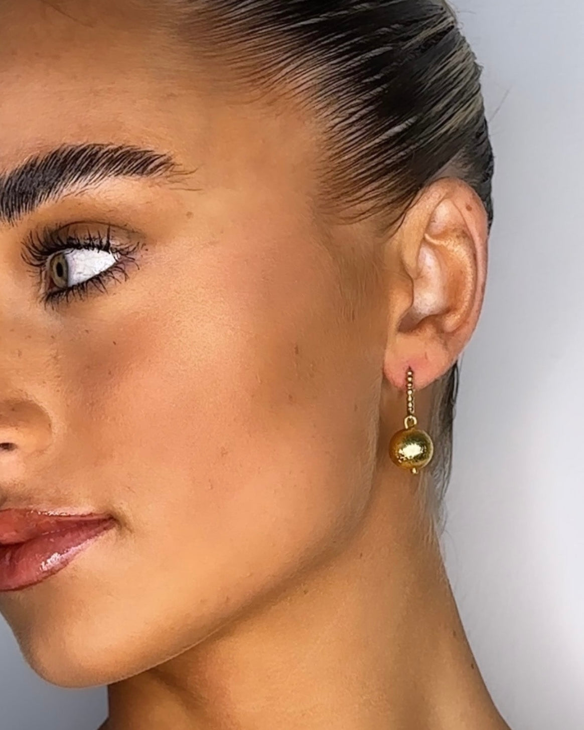 Zaina gold huggie earrings