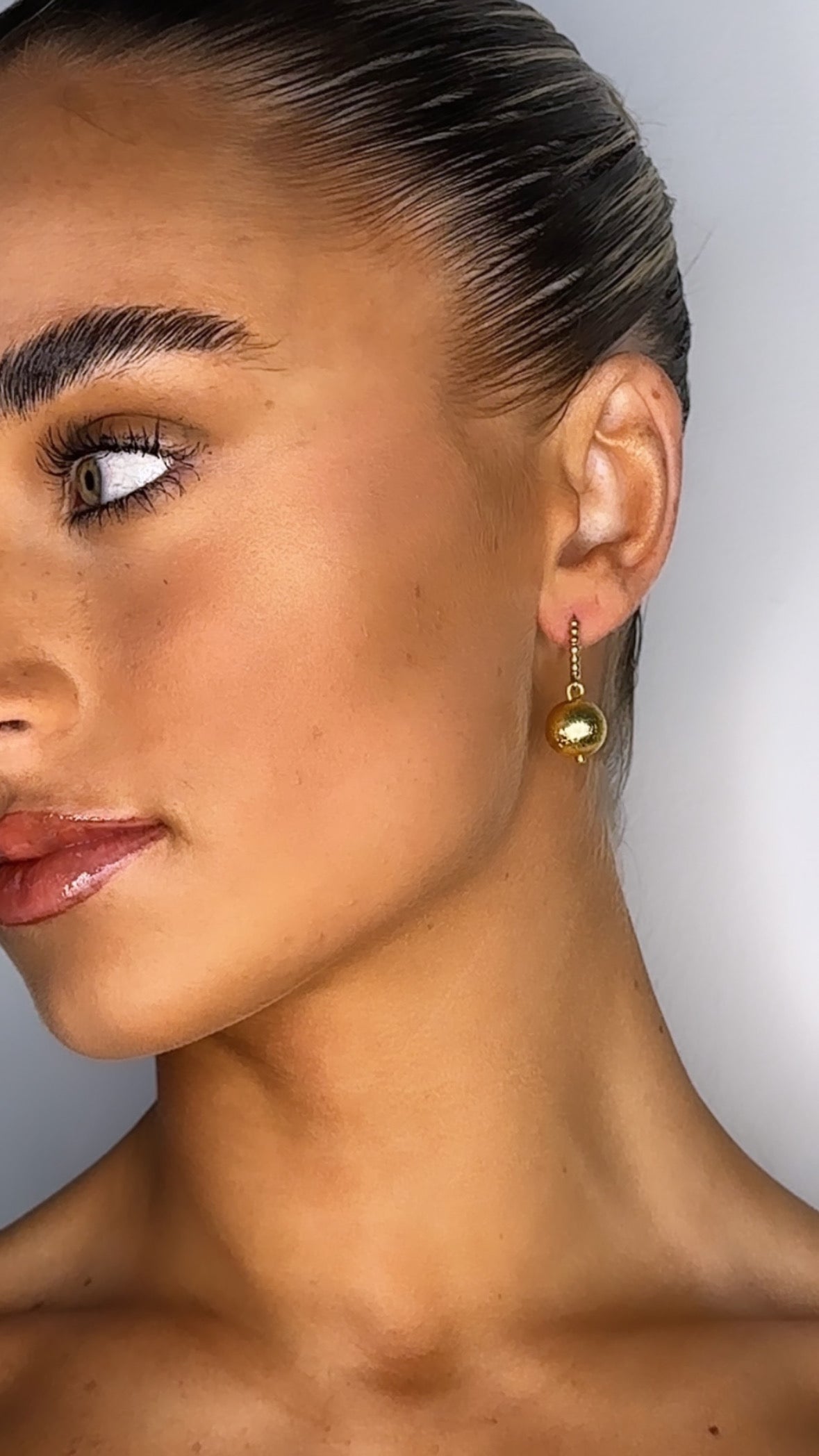 Zaina gold huggie earrings