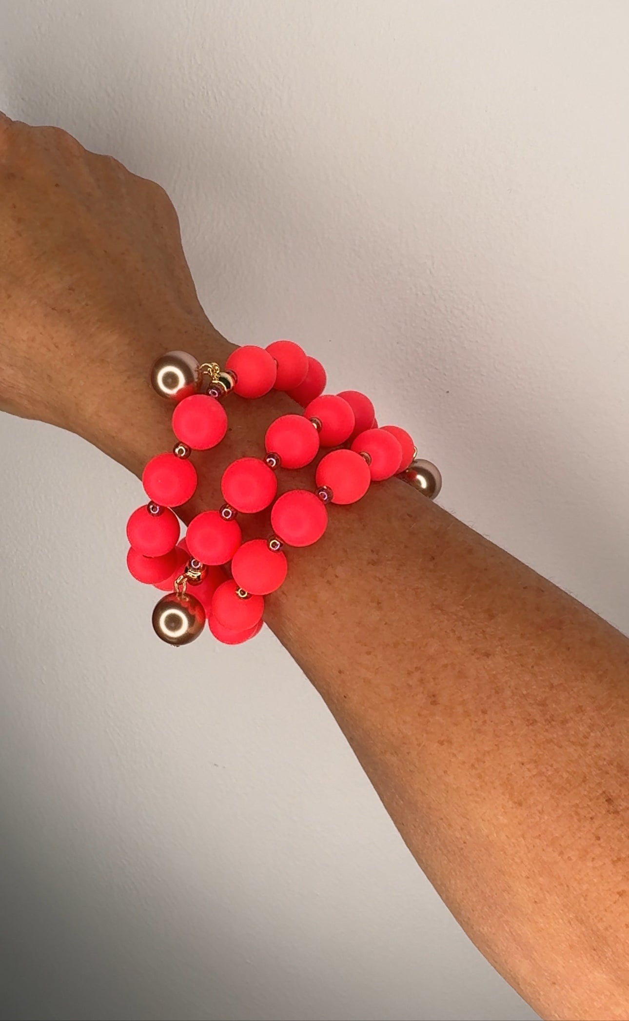 Beau neon strawberry beaded charm bracelets