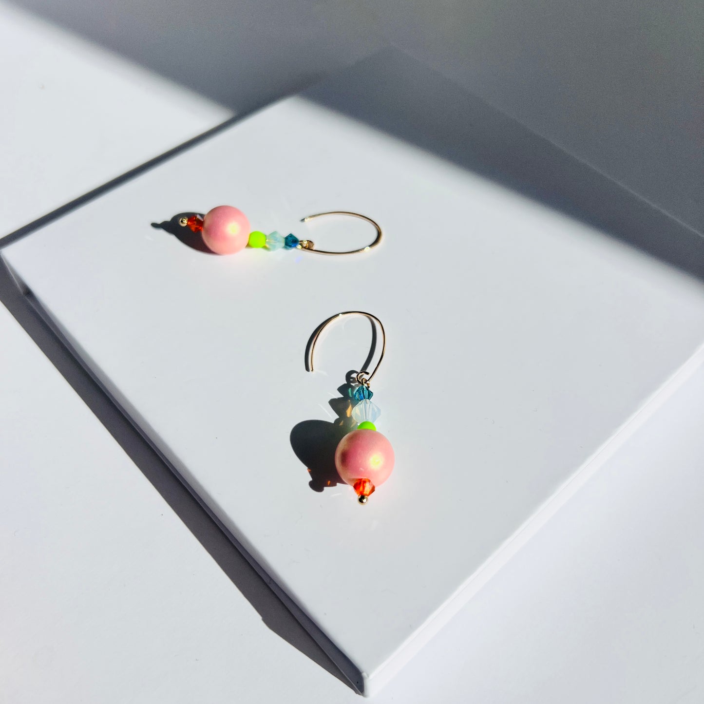 Poppy earrings in peachy pink